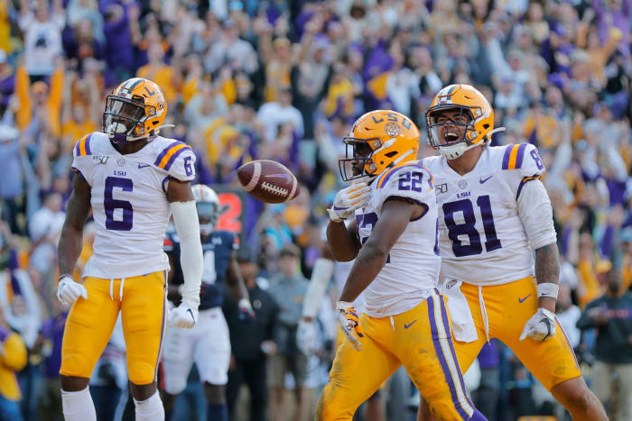 LSU running back Clyde Edwards-Helaire (22) celebrates his touchdown with tight end Thaddeus Moss (81) and wide receiver Terrace Marshall Jr. (6) in the second half of an NCAA college football game against Auburn in Baton Rouge, La., . LSU won 23-20